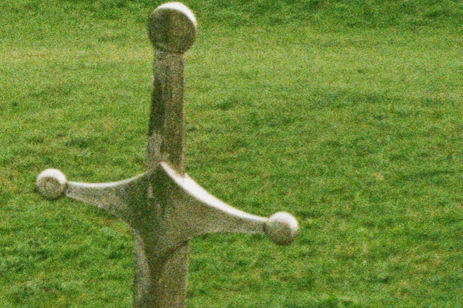 A 100% detail crop of a monumental sword and grass at the Didgori Battle Memorial from the original lab JPEG.